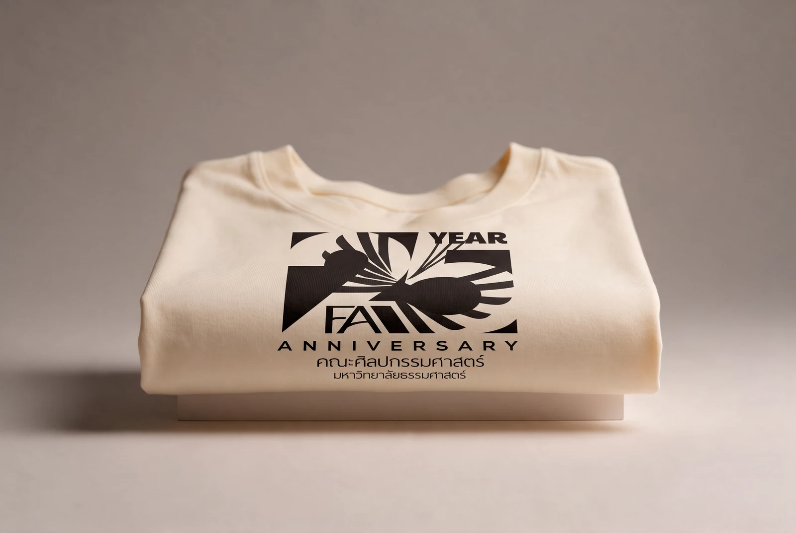 Staff sweatshirt — the full lockup at chest size on cream fleece, about the smallest the whole lockup is allowed to run.