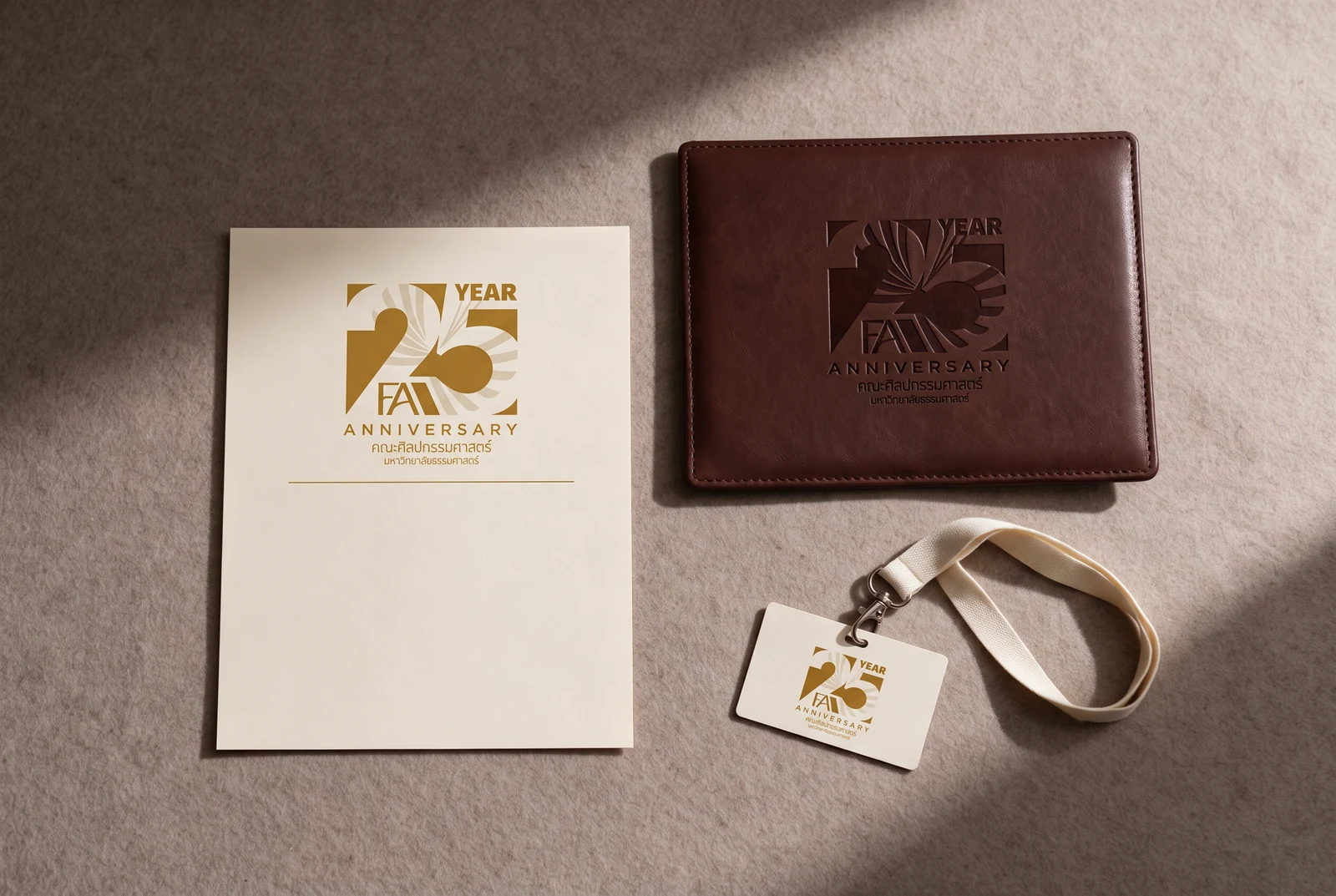 Certificate, leather portfolio and name badge — the same lockup foiled on three grounds, each at the size its piece allows.